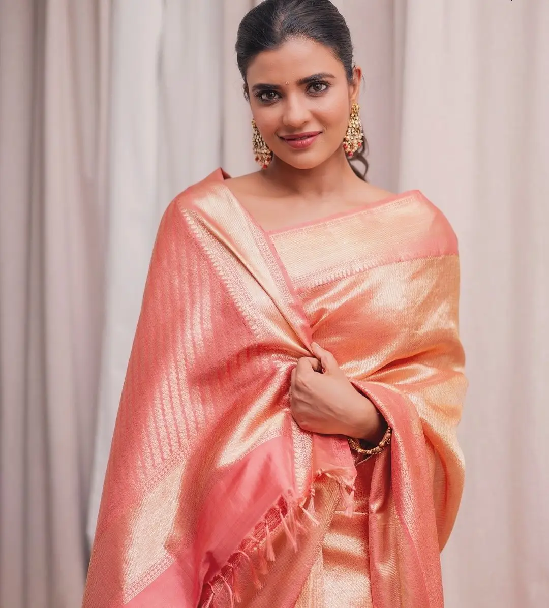 Indian Actress Aishwarya Rajesh in Orange Pattu Saree Blouse